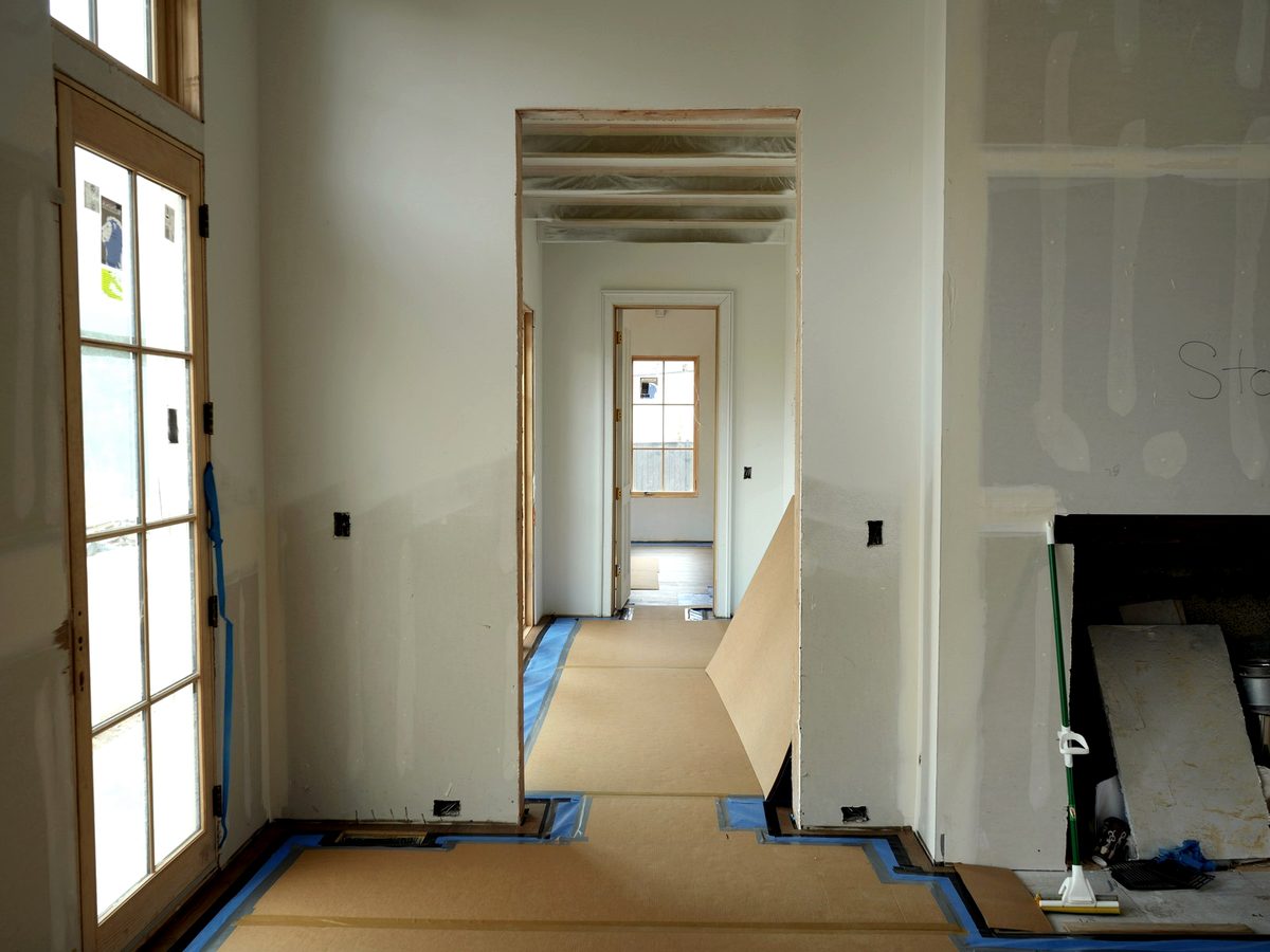 Floor protection installed through transitions, edges, and high-traffic paths