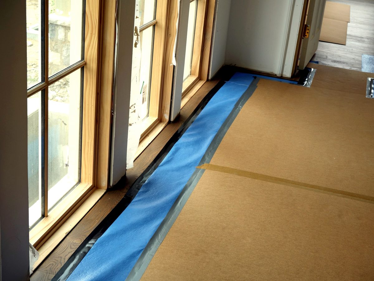 Perimeter floor protection detail along finished edges
